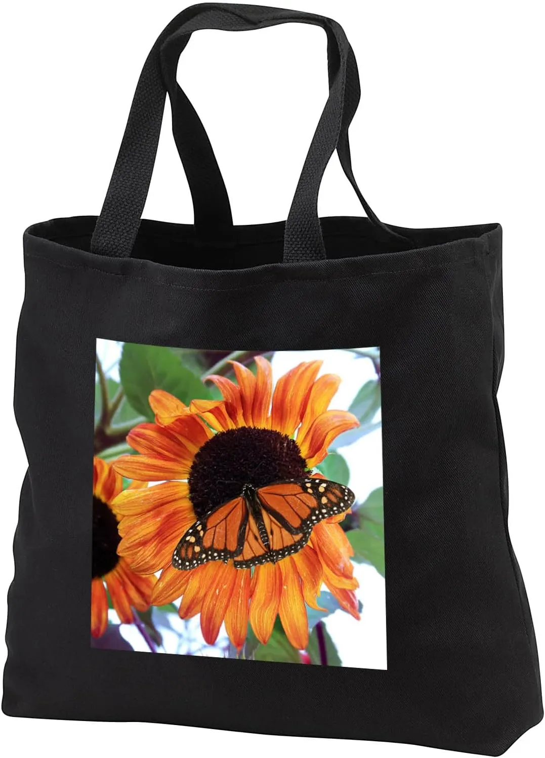 3dRose Photograph of a male monarch butterfly on an orange and red... - Tote Bags (tb_327120)